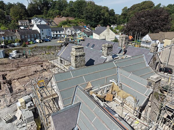 Looking down on the Island House roofscape: new slate, repaired chimney stacks and scaffolding.